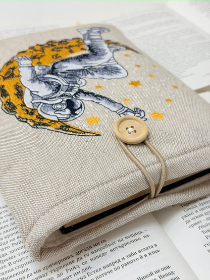 Embroidered Astronaut Book Sleeve – Padded Linen Book Cover, Cosmic Moon & Stars Design by Lullaby Crafts World