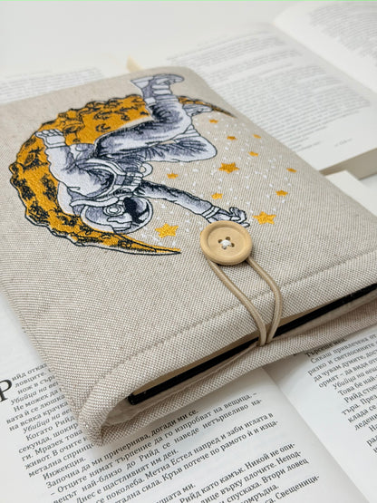 Embroidered Astronaut Book Sleeve – Padded Linen Book Cover, Cosmic Moon & Stars Design by Lullaby Crafts World