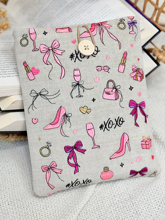 handmade embroidered pink coquette book sleeve with bows heels and lipstick design
