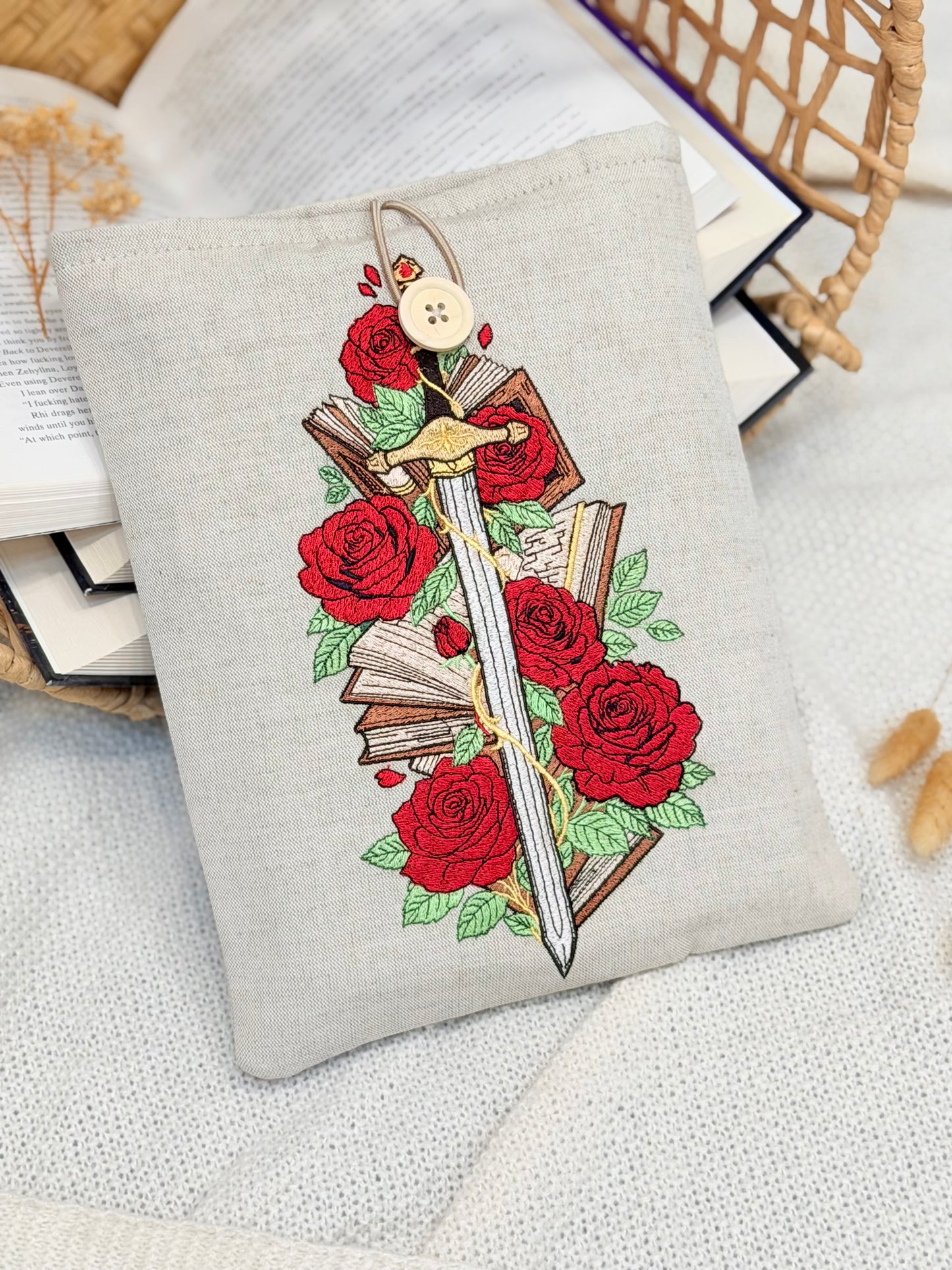 handmade embroidered sword and roses book sleeve with red floral design on linen fabric